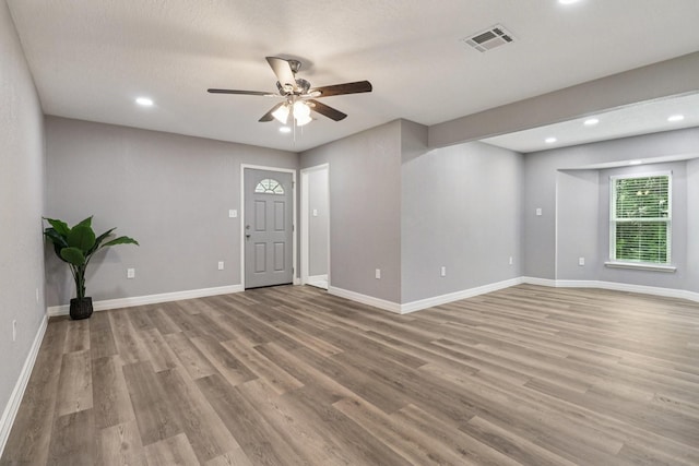 16820 Laurelwood Dr, Channelview, TX 77530 - empty room with light wood-style floors, a ceiling fan, and recessed lighting