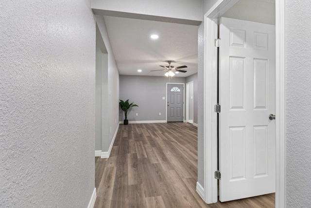 16820 Laurelwood Dr, Channelview, TX 77530 - hallway featuring a textured wall, wood finished floors, and recessed lighting