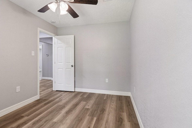 16820 Laurelwood Dr, Channelview, TX 77530 - spare room featuring ceiling fan, wood finished floors, and a smoke detector