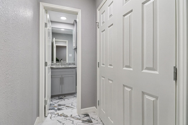 16820 Laurelwood Dr, Channelview, TX 77530 - hall featuring light marble finish flooring and a textured wall