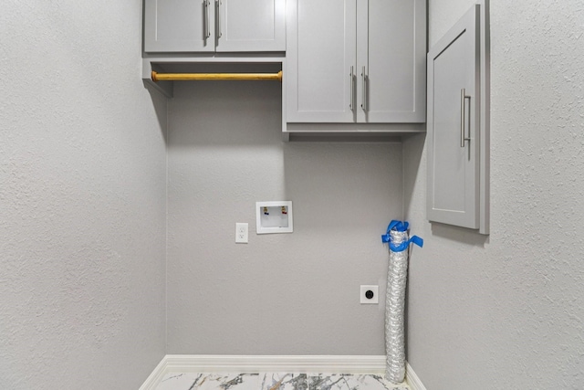 16820 Laurelwood Dr, Channelview, TX 77530 - laundry area featuring electric dryer hookup, hookup for a washing machine, marble finish floors, cabinet space, and a textured wall