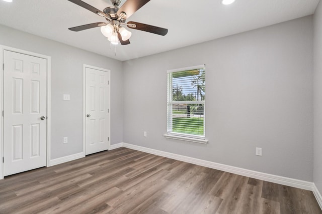 16820 Laurelwood Dr, Channelview, TX 77530 - unfurnished bedroom with wood finished floors, recessed lighting, and ceiling fan