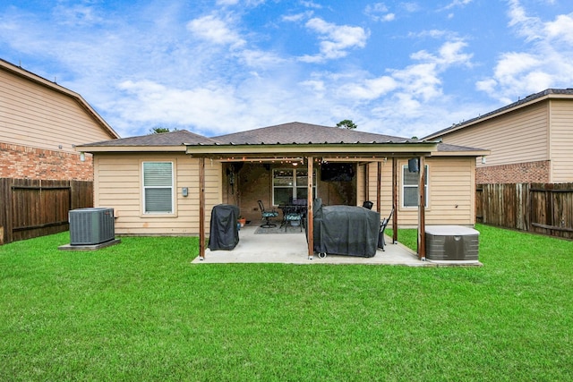 38327 Miranda Ln, Magnolia, TX 77355 - back of house with a fenced backyard and a patio area
