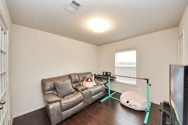38327 Miranda Ln, Magnolia, TX 77355 - living area featuring baseboards and dark wood-style floors