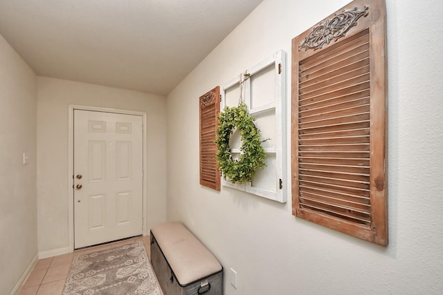 38327 Miranda Ln, Magnolia, TX 77355 - doorway to outside featuring light tile patterned floors and baseboards
