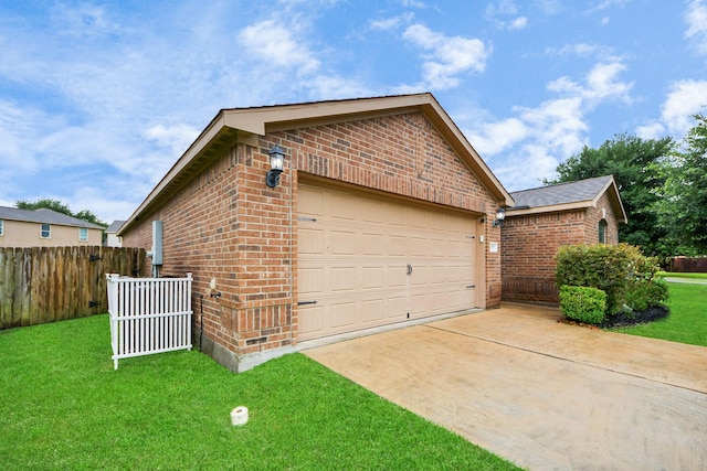 38327 Miranda Ln, Magnolia, TX 77355 - view of home's exterior featuring brick siding, an outbuilding, concrete driveway, and an attached garage