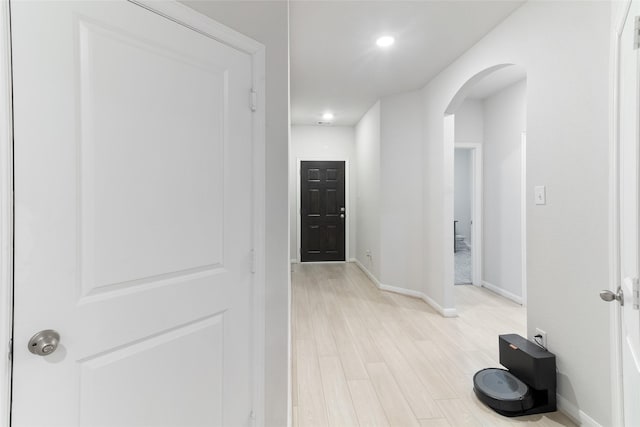 214 Water Grass Trl, Clute, TX 77531 - corridor with arched walkways, light wood finished floors, and recessed lighting
