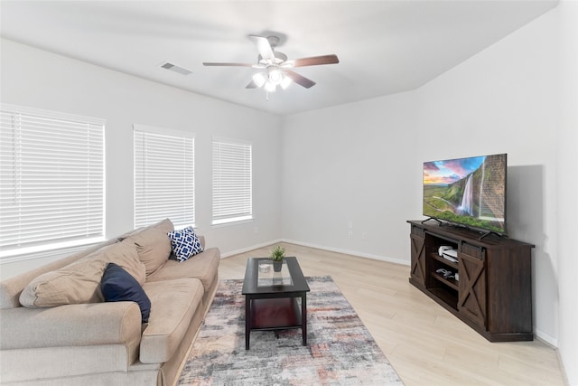 214 Water Grass Trl, Clute, TX 77531 - living room featuring ceiling fan and light wood finished floors