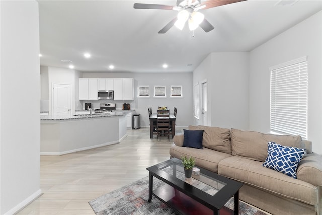 214 Water Grass Trl, Clute, TX 77531 - living area with a ceiling fan, recessed lighting, and light wood finished floors