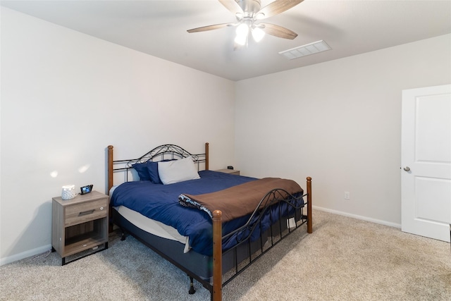 214 Water Grass Trl, Clute, TX 77531 - bedroom with light colored carpet and a ceiling fan