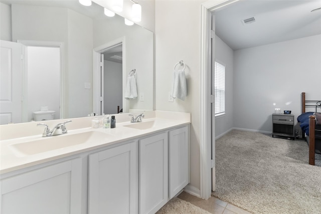 214 Water Grass Trl, Clute, TX 77531 - full bath featuring double vanity and tile patterned floors
