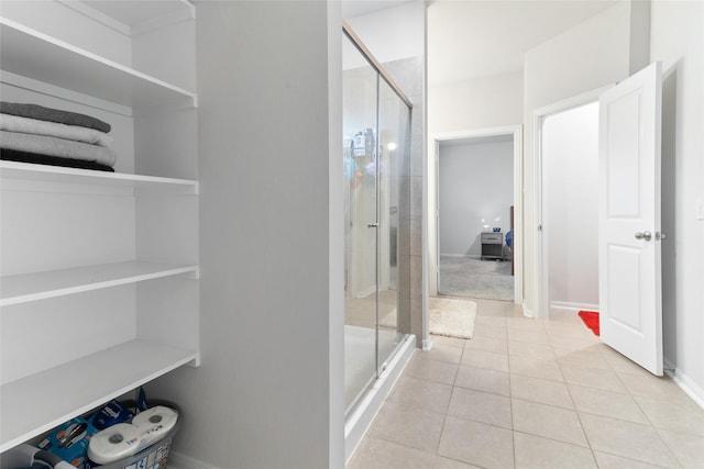 214 Water Grass Trl, Clute, TX 77531 - full bathroom featuring a shower stall and tile patterned flooring
