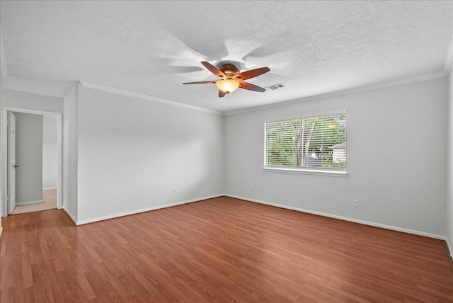 1726 Kemah Oaks Dr, Kemah, TX 77565 - spare room with ceiling fan, wood finished floors, ornamental molding, and a textured ceiling