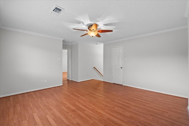 1726 Kemah Oaks Dr, Kemah, TX 77565 - empty room with light wood-style flooring, ceiling fan, crown molding, and a textured ceiling