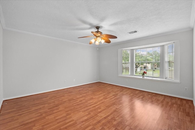 1726 Kemah Oaks Dr, Kemah, TX 77565 - empty room with wood finished floors, a ceiling fan, ornamental molding, and a textured ceiling