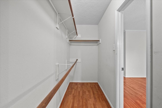 1726 Kemah Oaks Dr, Kemah, TX 77565 - walk in closet with wood finished floors