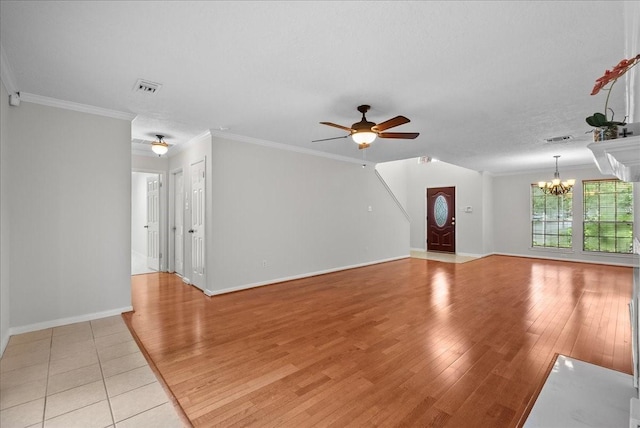 1726 Kemah Oaks Dr, Kemah, TX 77565 - unfurnished living room featuring a chandelier, a ceiling fan, light wood-type flooring, and ornamental molding