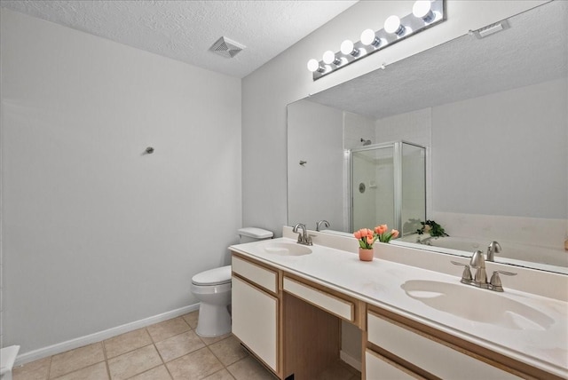 1726 Kemah Oaks Dr, Kemah, TX 77565 - full bathroom featuring a textured ceiling, a stall shower, tile patterned floors, double vanity, and a bath