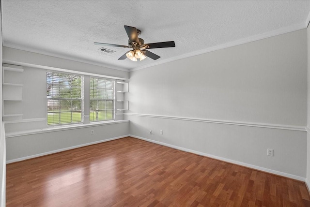 1726 Kemah Oaks Dr, Kemah, TX 77565 - spare room featuring a textured ceiling, wood finished floors, a ceiling fan, and crown molding