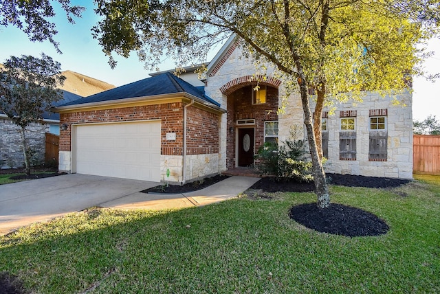 28015 Silverstream Ct, Fulshear, TX 77441 - view of front of home featuring stone siding, an attached garage, driveway, and brick siding