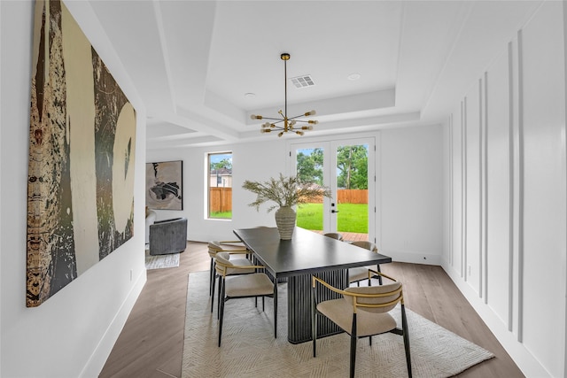 2031 Peppermill Rd, Houston, TX 77080 - dining space with a raised ceiling, a chandelier, wood finished floors, and french doors