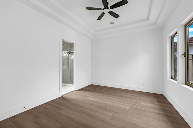 2031 Peppermill Rd, Houston, TX 77080 - unfurnished room featuring a raised ceiling, wood finished floors, and a ceiling fan