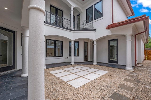 2031 Peppermill Rd, Houston, TX 77080 - rear view of property featuring a balcony, stucco siding, and a patio area