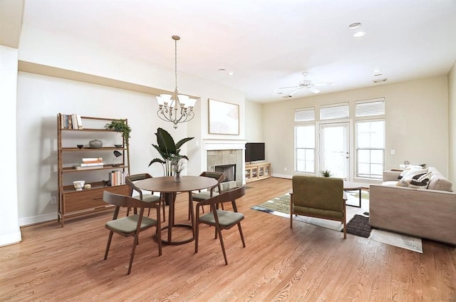 222 Knox St Unit F, Houston, TX 77007 - dining area with light wood finished floors, recessed lighting, a chandelier, ceiling fan, and a tiled fireplace