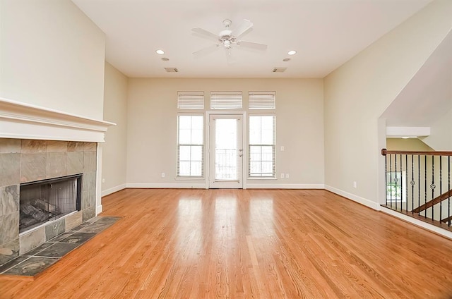 222 Knox St Unit F, Houston, TX 77007 - unfurnished living room with ceiling fan, a fireplace, wood finished floors, and recessed lighting