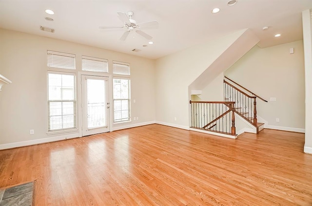 222 Knox St Unit F, Houston, TX 77007 - unfurnished living room featuring ceiling fan, light wood finished floors, recessed lighting, and stairway