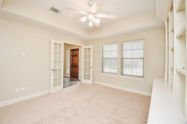 222 Knox St Unit F, Houston, TX 77007 - carpeted empty room with french doors, a raised ceiling, and ceiling fan