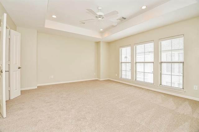 222 Knox St Unit F, Houston, TX 77007 - spare room featuring light colored carpet, a raised ceiling, recessed lighting, and ceiling fan