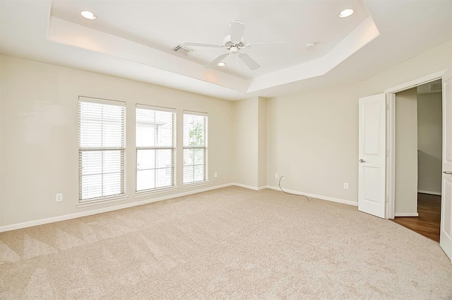 222 Knox St Unit F, Houston, TX 77007 - carpeted empty room with a tray ceiling, ceiling fan, and recessed lighting