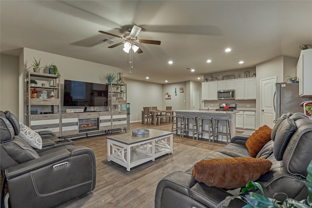 11503 Parrot Fish Ct, Conroe, TX 77304 - living room featuring a ceiling fan, light wood finished floors, and recessed lighting