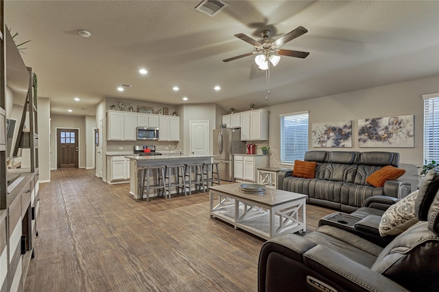 11503 Parrot Fish Ct, Conroe, TX 77304 - living area with ceiling fan, recessed lighting, and wood finished floors