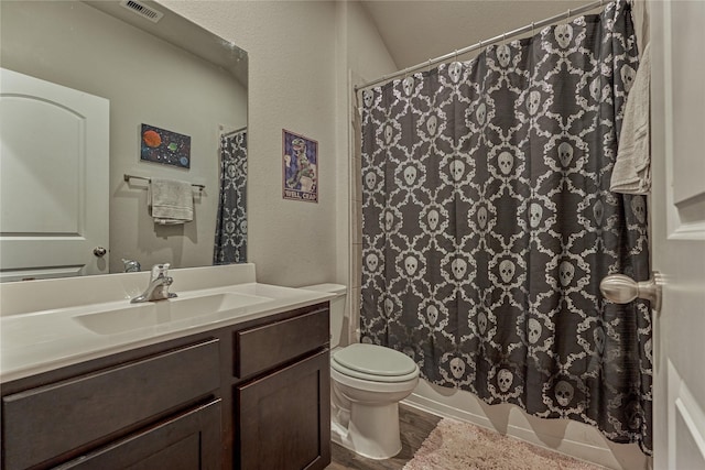 11503 Parrot Fish Ct, Conroe, TX 77304 - full bathroom featuring vanity, wood finished floors, curtained shower, and a textured wall
