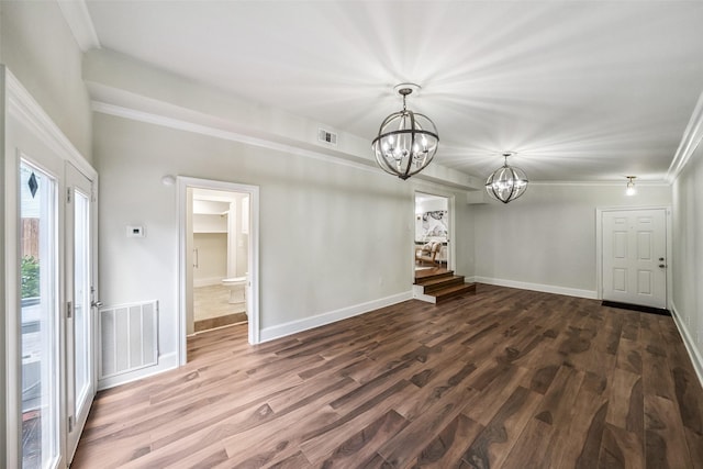 1114 W Cottage St, Houston, TX 77009 - unfurnished room with a chandelier, dark wood finished floors, and ornamental molding