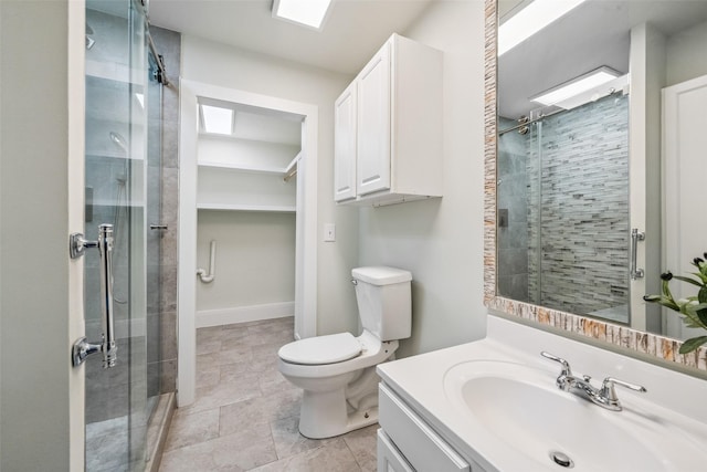 1114 W Cottage St, Houston, TX 77009 - full bathroom featuring a shower stall, vanity, and a walk in closet