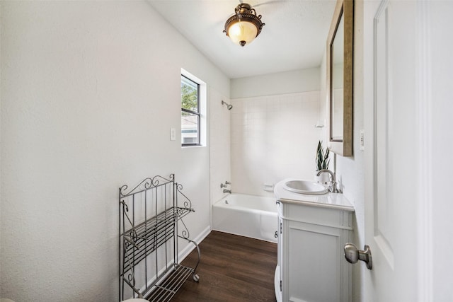 1114 W Cottage St, Houston, TX 77009 - bathroom with vanity, wood finished floors, and shower / washtub combination
