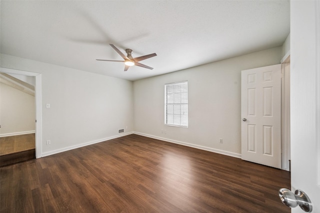 1114 W Cottage St, Houston, TX 77009 - unfurnished bedroom with dark wood-type flooring and ceiling fan