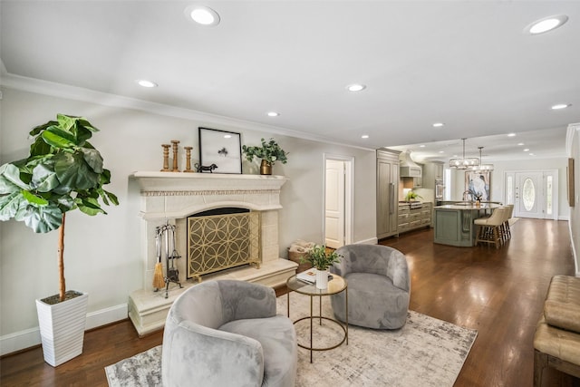 1114 W Cottage St, Houston, TX 77009 - living area with ornamental molding, dark wood finished floors, recessed lighting, and a premium fireplace
