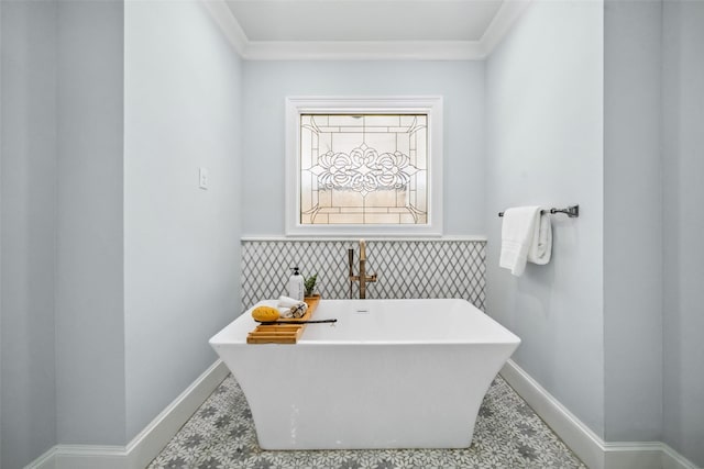 1114 W Cottage St, Houston, TX 77009 - bathroom featuring a freestanding bath, wainscoting, and crown molding