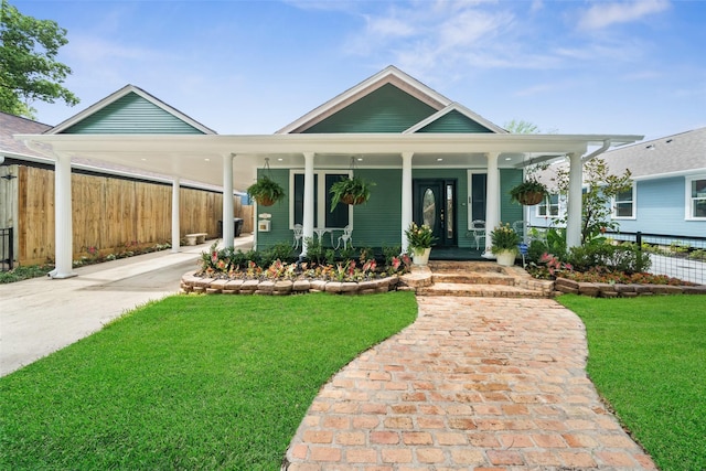1114 W Cottage St, Houston, TX 77009 - view of front facade with concrete driveway, covered porch, and a carport