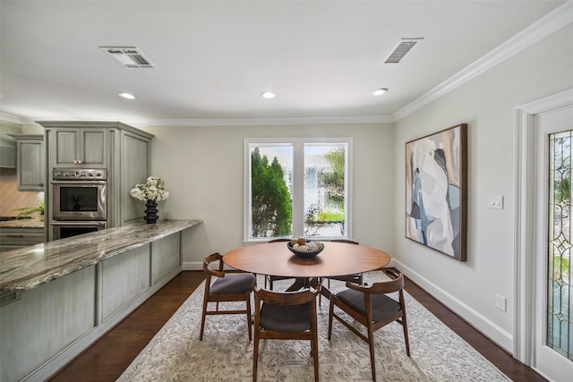 1114 W Cottage St, Houston, TX 77009 - dining room featuring healthy amount of natural light, ornamental molding, recessed lighting, and dark wood-type flooring