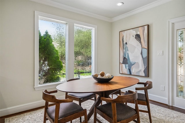 1114 W Cottage St, Houston, TX 77009 - dining area with wood finished floors, ornamental molding, and recessed lighting