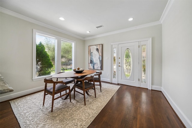 1114 W Cottage St, Houston, TX 77009 - dining area with dark wood-style floors, crown molding, and recessed lighting