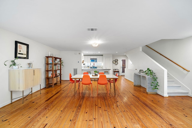 1821 Tuam St, Houston, TX 77004 - dining area with stairs, light wood-style flooring, and recessed lighting