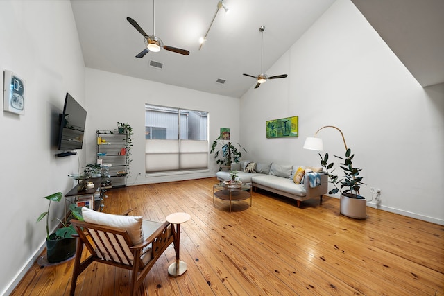 1821 Tuam St, Houston, TX 77004 - living area featuring a ceiling fan, high vaulted ceiling, and hardwood / wood-style floors