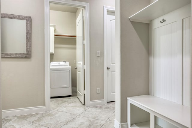 29114 Davenport Dr, Katy, TX 77494 - laundry area with washer / dryer, cabinet space, and light tile patterned flooring