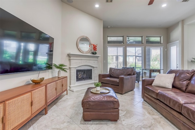 29114 Davenport Dr, Katy, TX 77494 - living area featuring a fireplace with raised hearth, recessed lighting, and ceiling fan